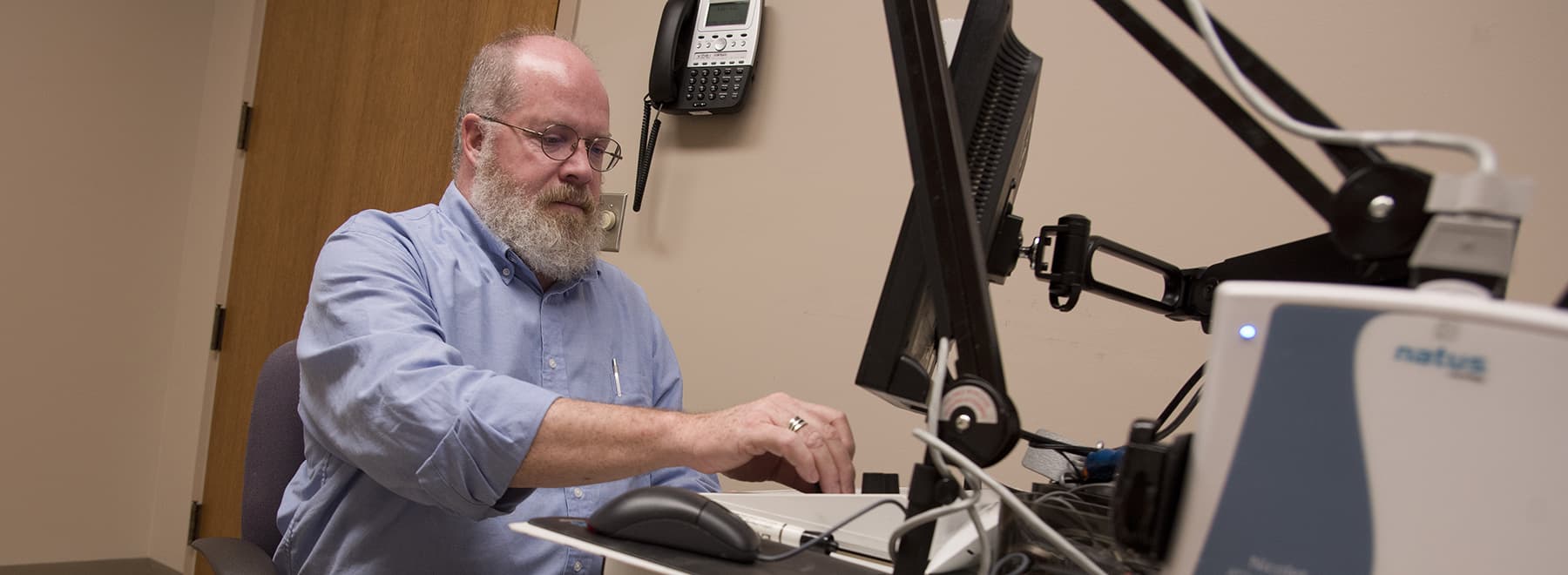 faculty member with lab equipment